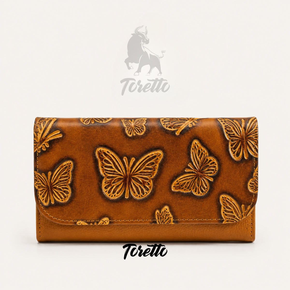 Billetera Aura de Toretto Cueros en cuero mostaza con diseño Mariposa Visos, vista frontal