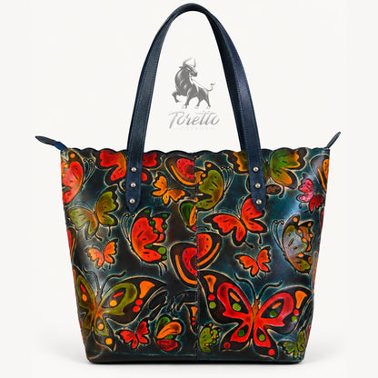 Bolso Cora de Toretto Cueros en cuero azul con diseño Mariposas, vista frontal
