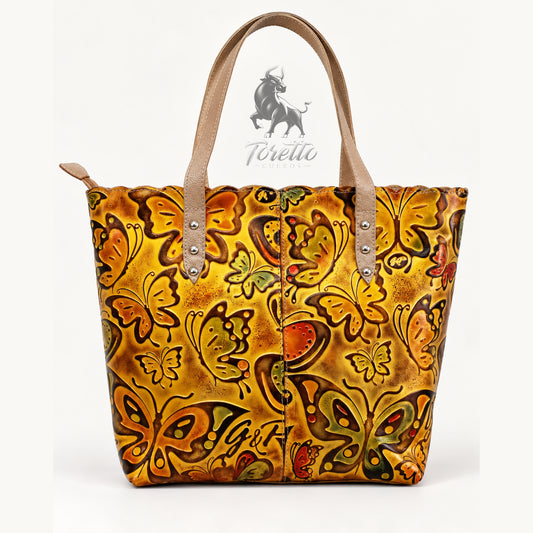 Bolso Cora de Toretto Cueros en cuero Dorado con diseño Mariposas, vista frontal