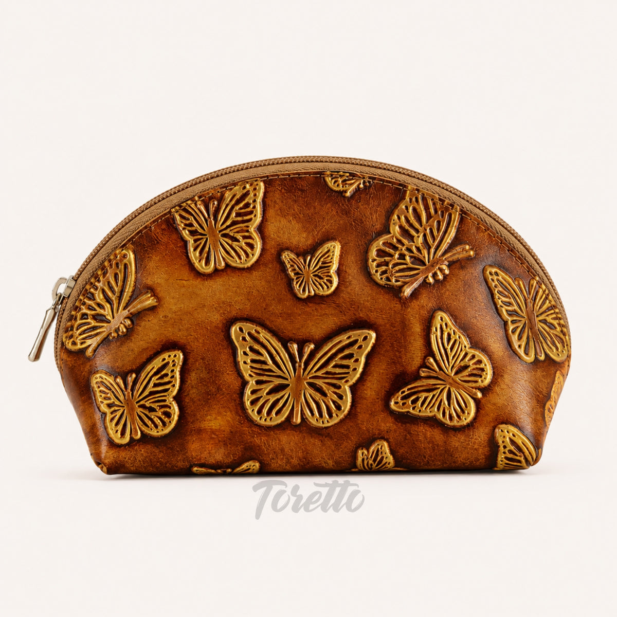 Cosmetiquera Verona de Toretto Cueros en cuero dorado con diseño Mariposa Visos, vista frontal