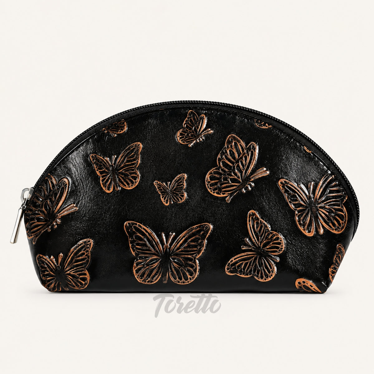 Cosmetiquera Verona de Toretto Cueros en cuero negro con diseño Mariposa Visos, vista frontal
