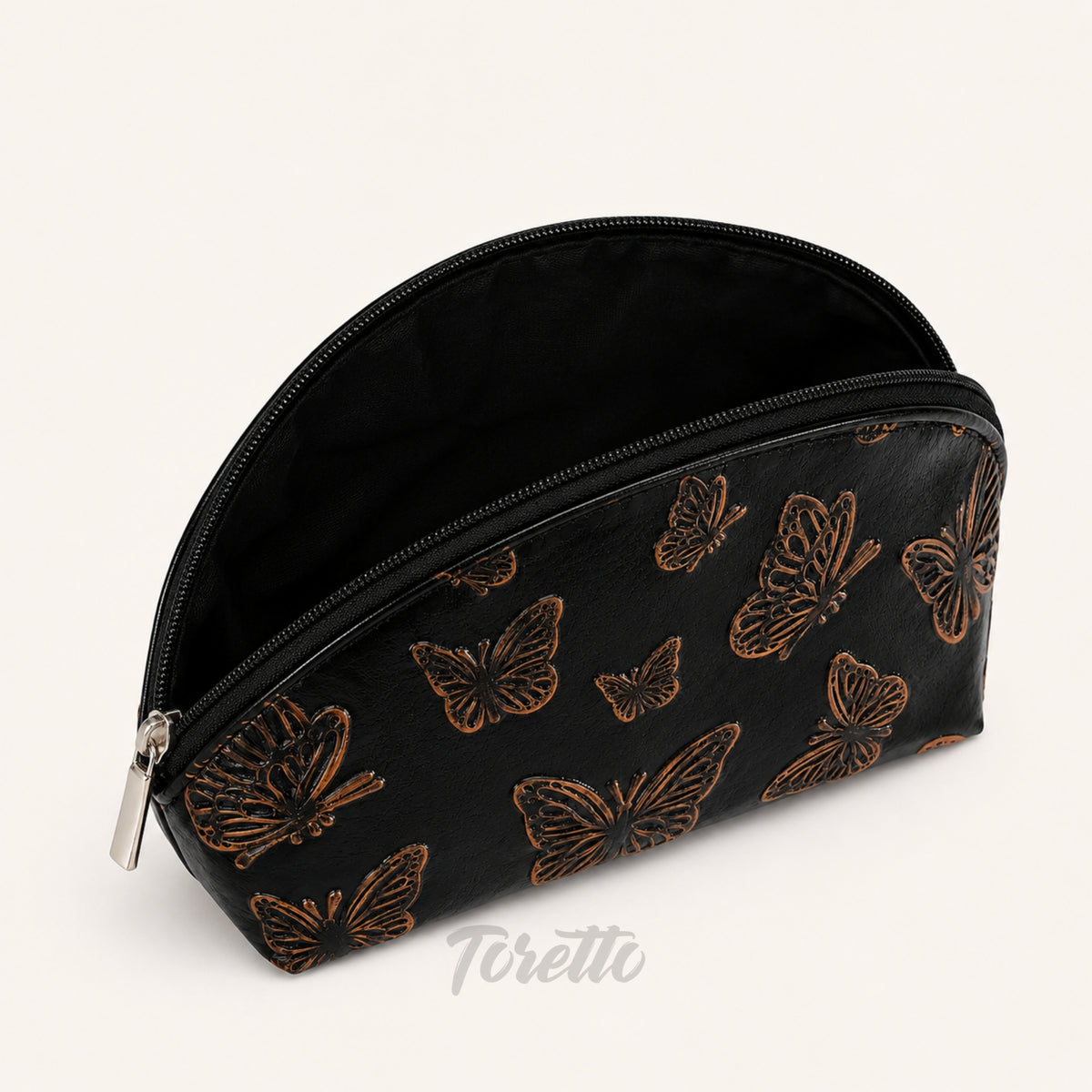 Cosmetiquera Verona de Toretto Cueros en cuero negro con diseño Mariposa Visos, vista superior abierto